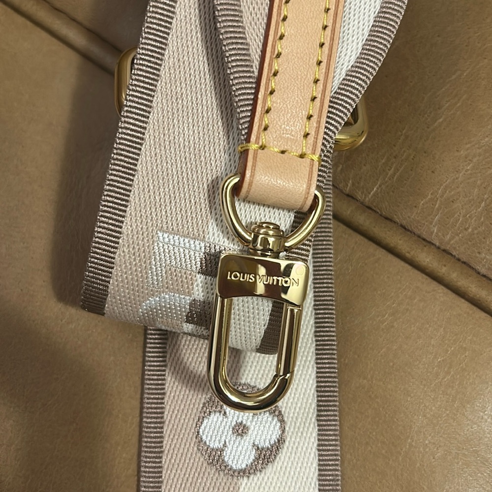 LV crossbody strap.